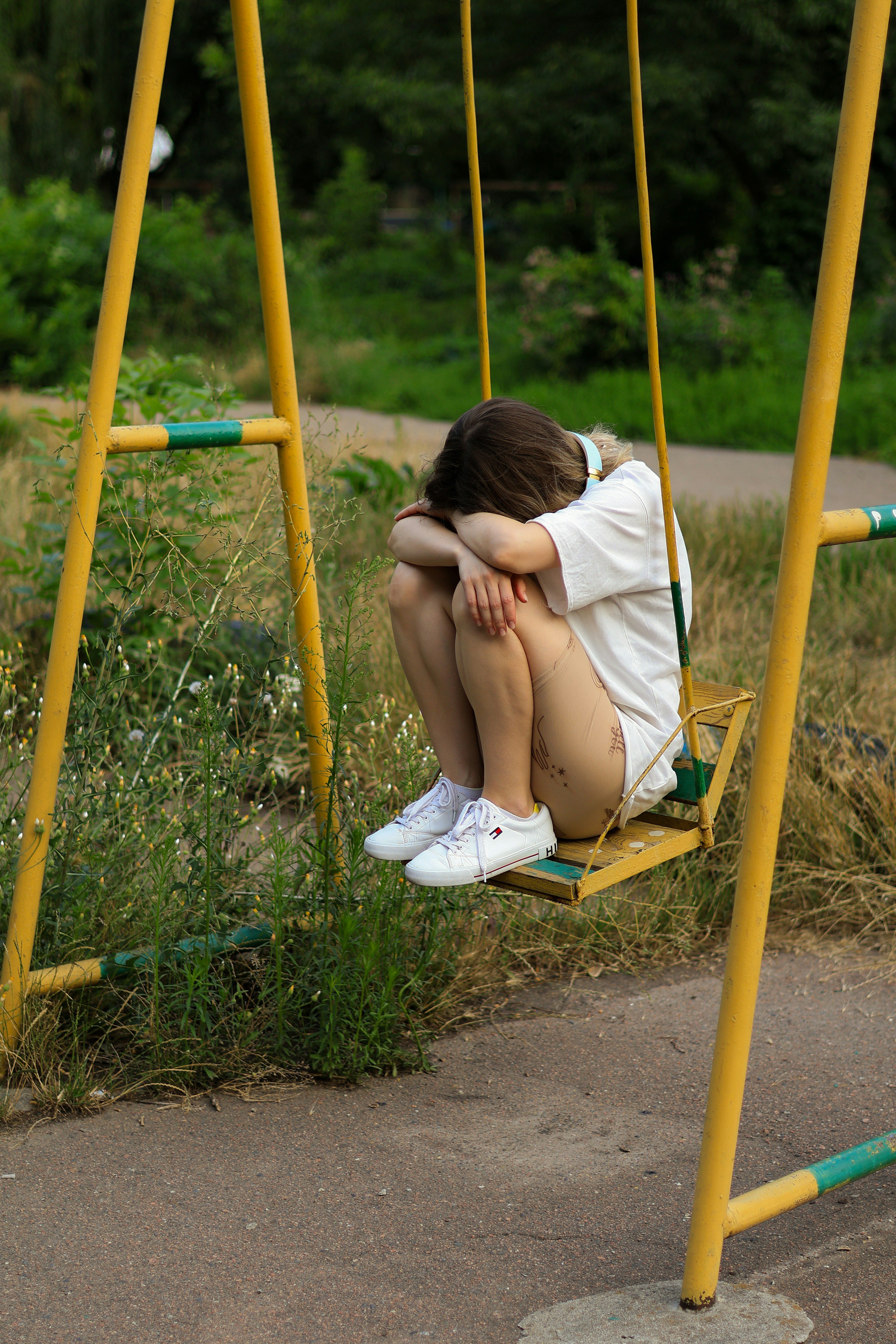 Empty swing set in a quiet space, representing feeling stuck and unable to take the first step toward therapy